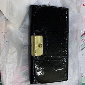 Black patent leather Coach wallet with baby blue interior. Cards as shown